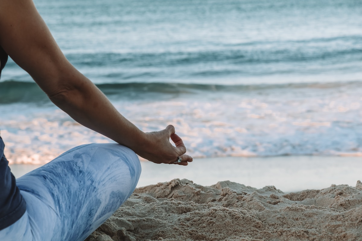 Quiet meditation at dusk showing how slowing down in the evening prepares the body for deep sleep